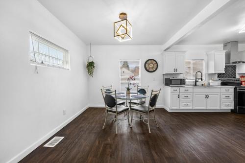 a kitchen and dining room with a table and chairs at Quiet Detroit 3BR | Near Downtown + WiFi in Detroit