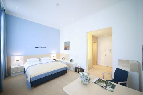 Ένα ή περισσότερα κρεβάτια σε δωμάτιο στο Hotel Navigare