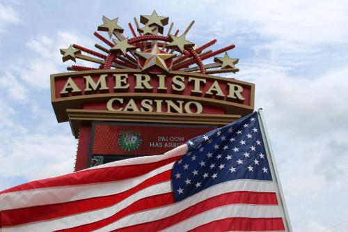 an american flag flies in front of the american casino at Ameristar Casino Hotel Vicksburg, Ms. in Vicksburg