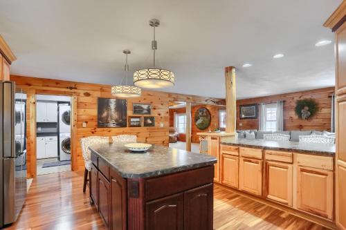 a kitchen with wooden cabinets and a large island at 15 off Summer Special - Wifi - Pet Friendly in Sigel