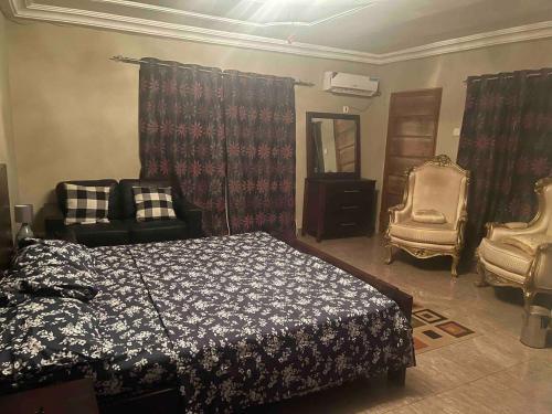 Llit o llits en una habitació de Rahman Resident