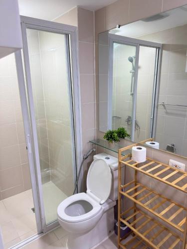 a bathroom with a toilet and a shower at Azure North - Aurora Sky in San Fernando