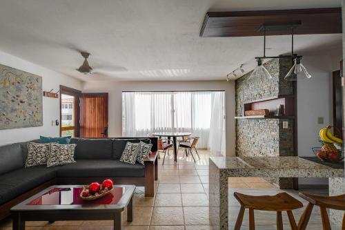a living room with a couch and a table at departamento de lujo, Puerto Vallarta. Mexico in Puerto Vallarta