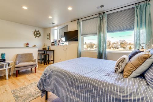 a bedroom with a bed and a window and a desk at Dtwn Walkability! Grand Junction Couple's Retreat in Grand Junction