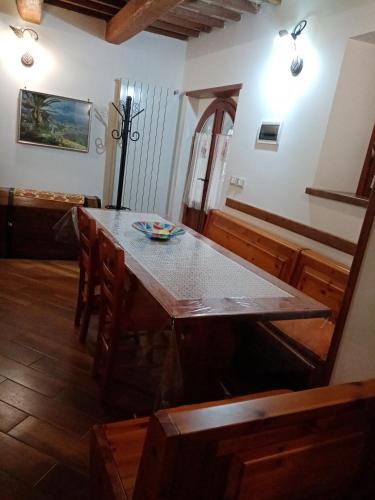 a dining room with a table with a bowl on it at Al Nido Del Passero 1 in Greccio