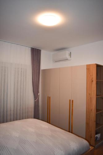 a bedroom with a bed and a ceiling at Villa Majra in Valbandon