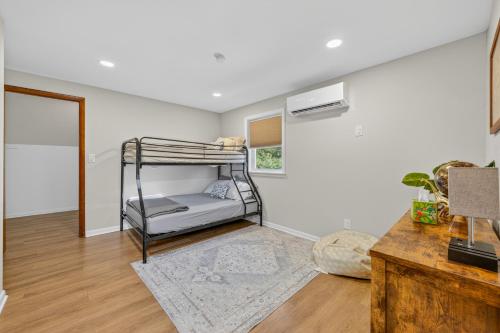 a bedroom with a bunk bed in a room at The Edamame House in Nazareth