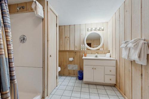 a bathroom with a sink and a toilet and a mirror at Bear's Crossing Retreat in Dover