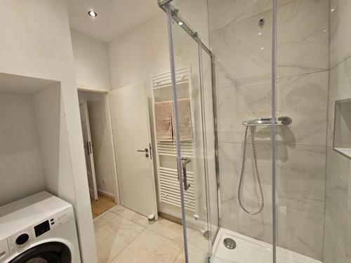 a shower with a glass door in a bathroom at Sero`s Apartment in Hahnstätten