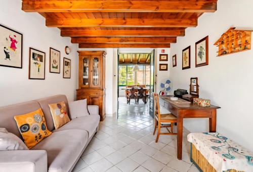 a living room with a couch and a table at Casa DAFNE in Lipari