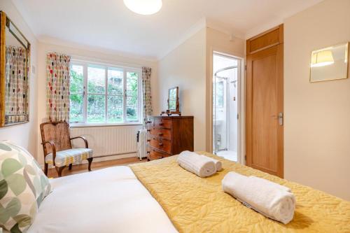 a bedroom with a bed with two pillows on it at 3 Bed in Worth Matravers oc-wy334 in Worth Matravers