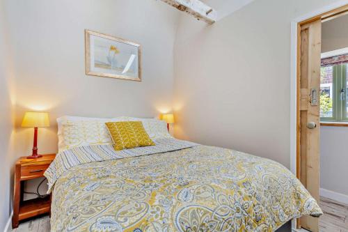 a bedroom with a bed with a yellow pillow on it at 1 Bed in Trimingham oc-h29803 in Trimingham