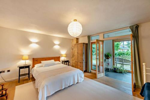 a bedroom with a bed and a large window at 3 Bed in Dartington oc-b30033 in Darlington
