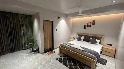 a bedroom with a large bed and a large window at Hotel City View in Golāghāt