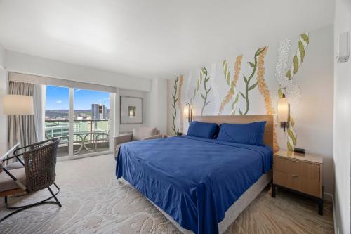 a bedroom with a blue bed and a balcony at Luxury Ala Moana Resort 25th floor with balcony in Honolulu
