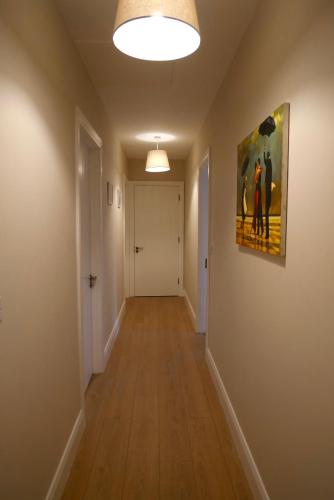 an empty hallway with a painting on the wall at McGinns Cottage in Kilcormac