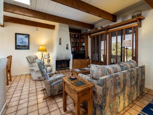 a living room with a couch and a fireplace at Artist Road #31 in Santa Fe