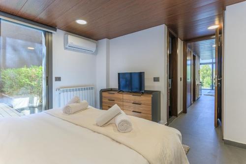 Llit o llits en una habitació de Stunning 4 Bedroom Duplex