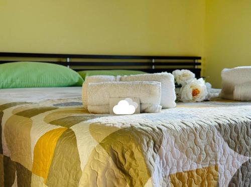 a bed with an apple computer on top of it at Casa Orchidea Altera in Marzamemi