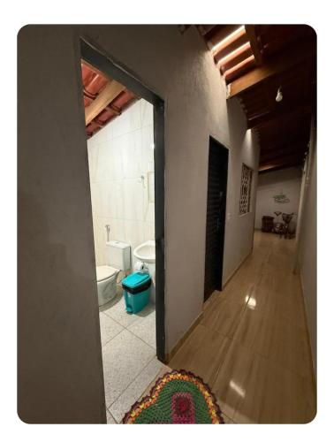 a room with a bathroom with a toilet and a mirror at Casa da Vila de São Jorge in Sao Jorge