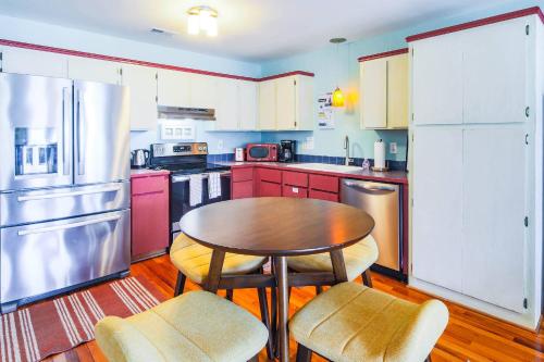 a kitchen with a table and chairs in it at Hang 6 in Folly Beach