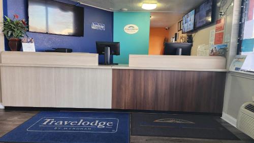 a counter in a store with acision at Travelodge by Wyndham Houston Hobby Airport in Houston