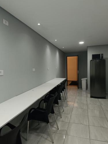 a conference room with a long table and chairs at Hotel Connect Ibira Servidor Park in São Paulo