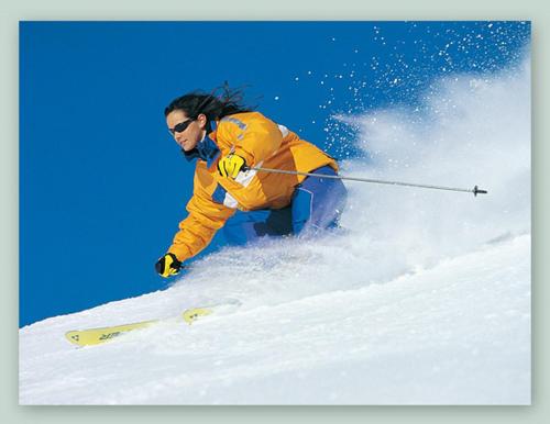 a person is skiing down a snow covered slope at GarniHotel - Arberblick in Lohberg