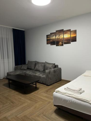 a living room with a couch and a coffee table at Kerulis Apartments in Vilnius