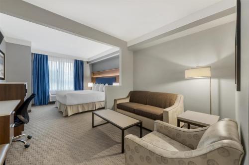 a hotel room with a couch and a bed at Best Western Plus Revelstoke in Revelstoke
