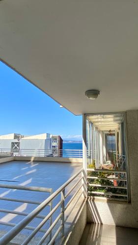a balcony of a building with a view of the ocean at Borde Costero in Valparaíso