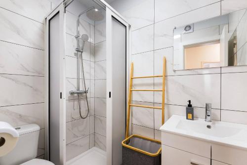 a bathroom with a shower and a toilet and a sink at Sol Blessing by GALMI in Ponta do Sol