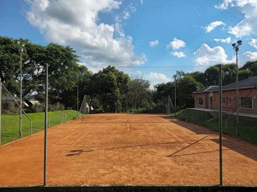 a tennis court with a net on top of it at Terrazas de San Lorenzo - Salta in San Lorenzo