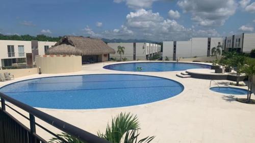a large swimming pool in a resort at Casa de Verano Málaga Confort Sol y Piscina in Ricaurte