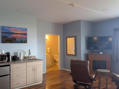 a kitchen with a desk and a chair in a room at The Waterfront at Potlatch in Shelton