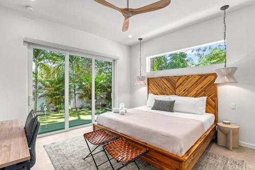 a bedroom with a bed and a large window at Waldemere's Wonderland in Sarasota