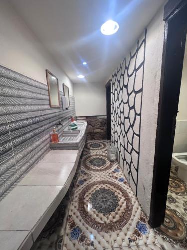 a bathroom with a sink and a mosaic floor at قمه التجلي in Saint Catherine