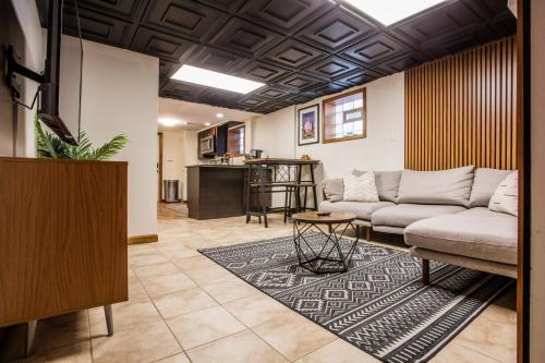 a living room with a couch and a table at Stylish Garden-Level 2BR: Quiet Neighborhood in Chicago