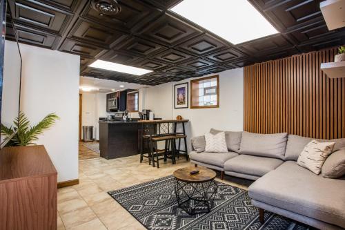 a living room with a couch and a table at Stylish Garden-Level 2BR: Quiet Neighborhood in Chicago
