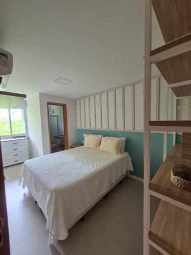 a bedroom with a bed and a ladder at Paraíso em Imbassaí in Imbassai