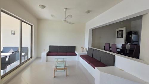 a living room with a couch and a table at Casa Chaue in Tangolunda
