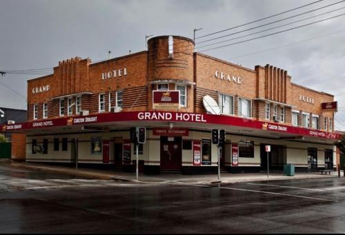 a large brick building on the corner of a street at Bega Grand Hotel in Bega