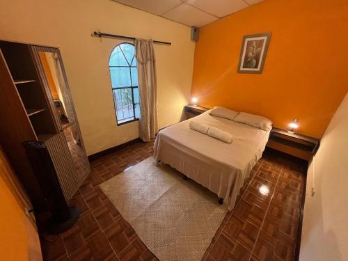 Llit o llits en una habitació de Casa Cacao