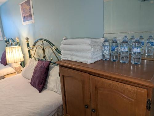 a group of bottles of water on top of a counter at Calgary Star Cozy Home in Calgary