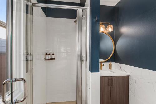 a bathroom with a shower and a sink at Rooftop Retreat with Workspace and BBQ in Denver