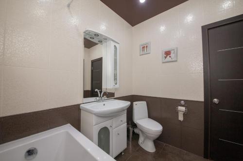 Kylpyhuone majoituspaikassa Apartment Alekseeva 45