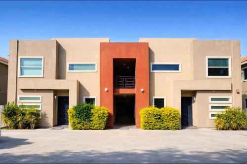 a building with a large door in front of it at Luxe 3BR & 2BA Condo Near Airport & Shopping Mall in McAllen