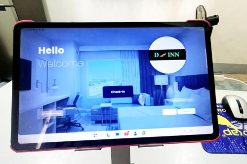 a computer monitor sitting on a table with a screen at D New Inn Mactan in Lapu Lapu City