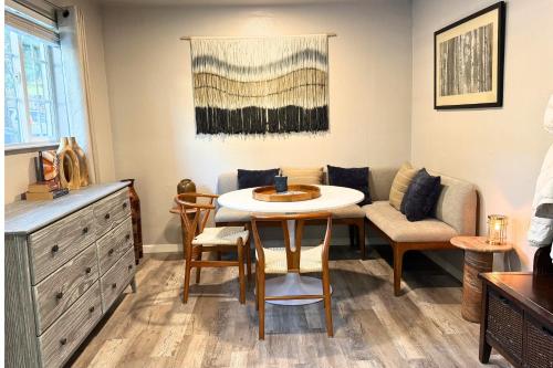 a living room with a table and chairs and a couch at The Iceberg Tahoe in South Lake Tahoe