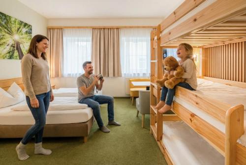 a group of people standing in a hotel room at Hotel Nummerhof in Erding